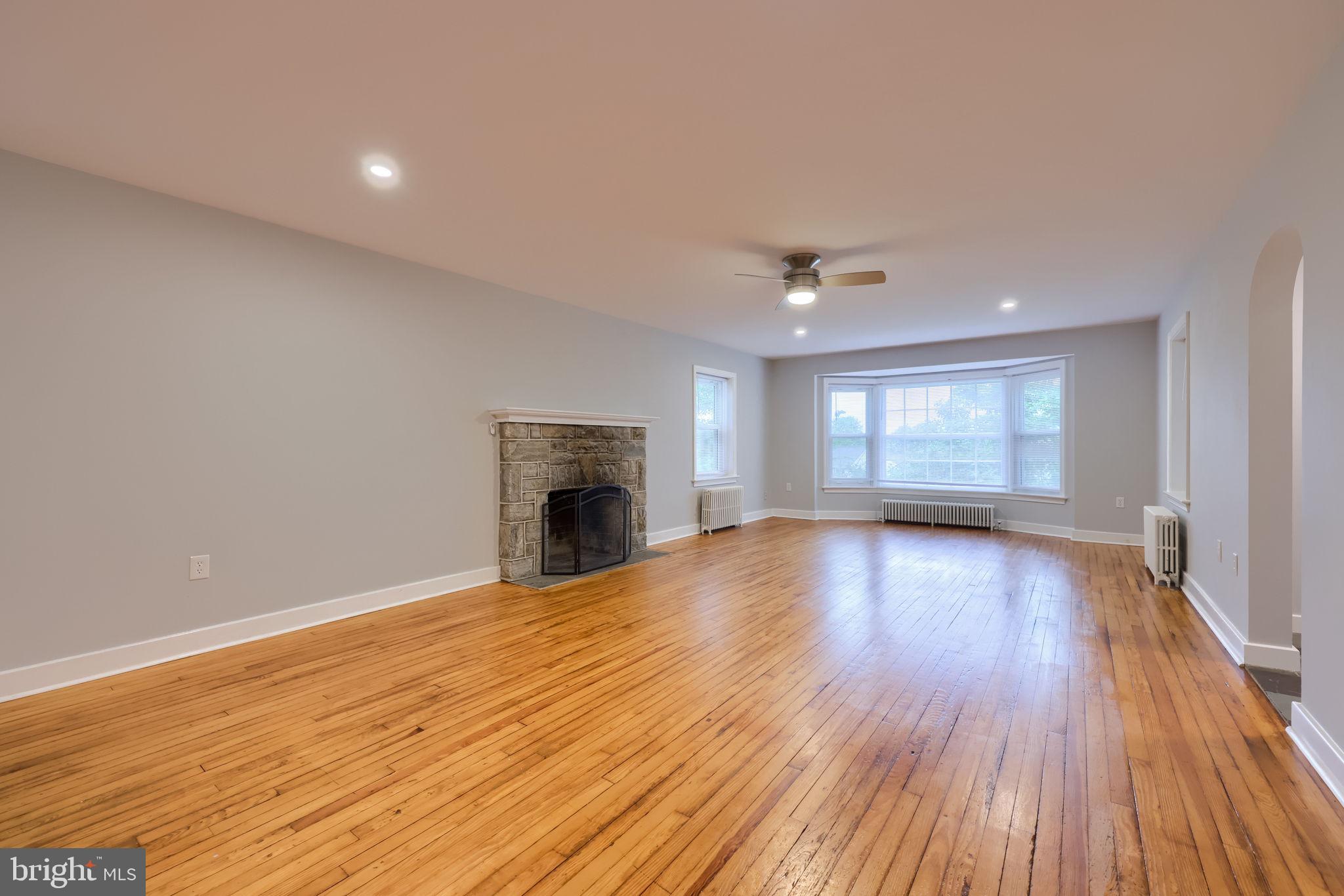 145 Weaver Road Lancaster, PA 17603 - Photo 36 of 87 a view of empty room with wooden floor and fireplace