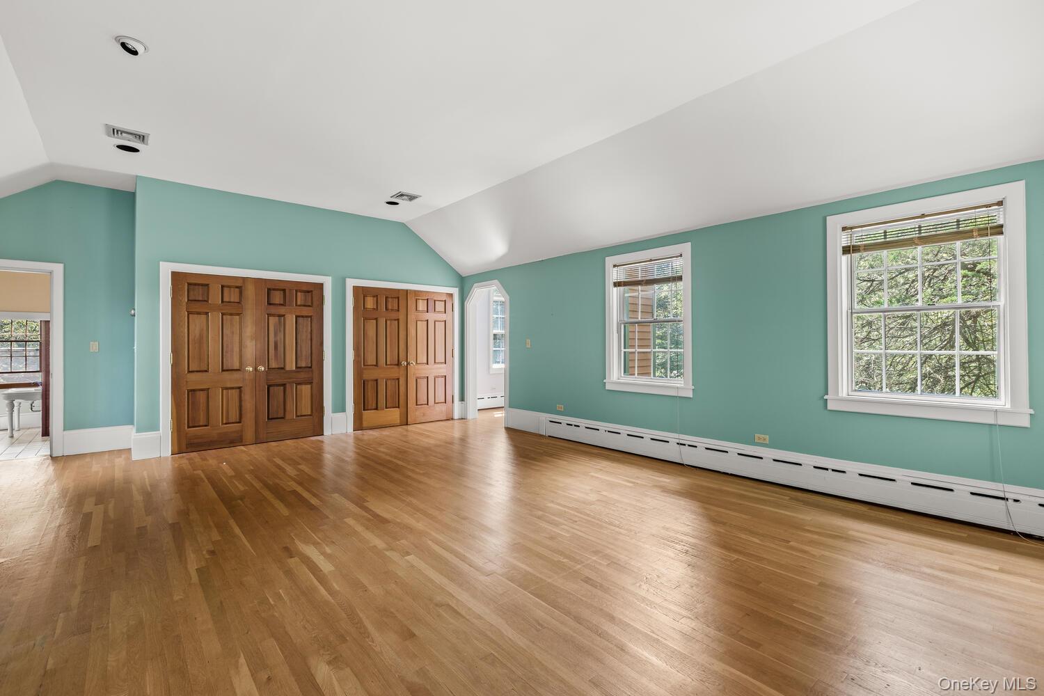 81 Glendale Road Ossining, NY 10562 - Photo 15 of 37 The unfurnished room featuring vaulted ceiling, ample closet space and a fireplace that is not in the view