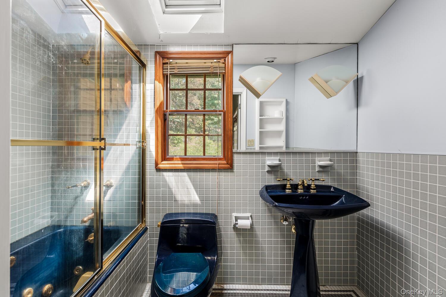 81 Glendale Road Ossining, NY 10562 - Photo 22 of 37 Second bathroom featuring tile walls and enclosed tub /shower combo