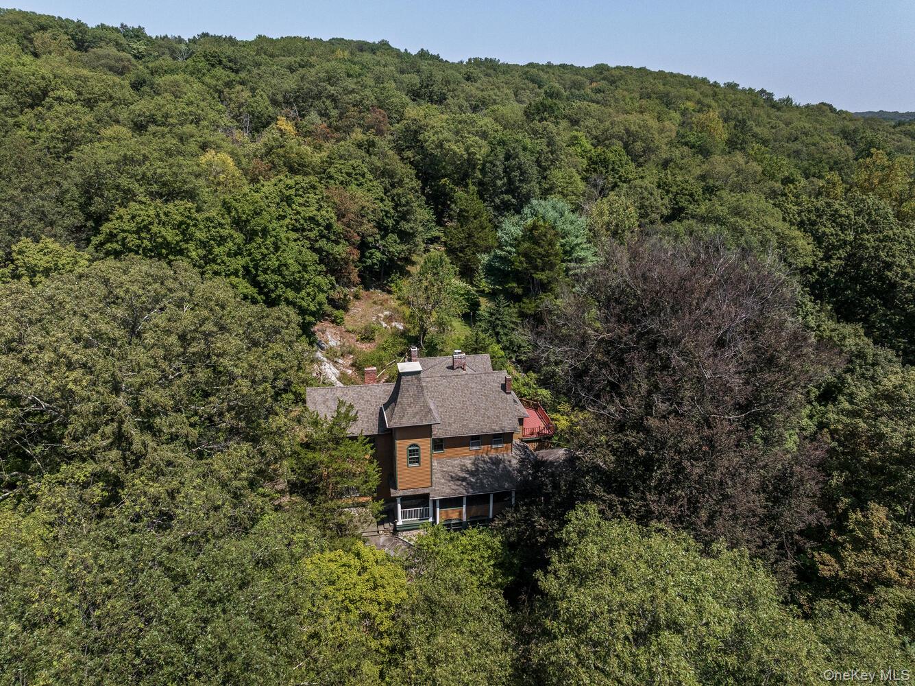81 Glendale Road Ossining, NY 10562 - Photo 37 of 37 View from above of property featuring a forest