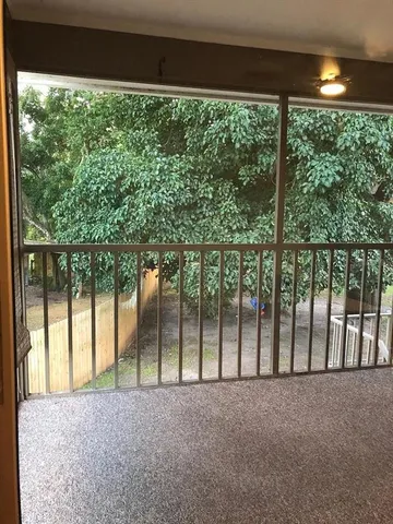 a view of porch with a yard