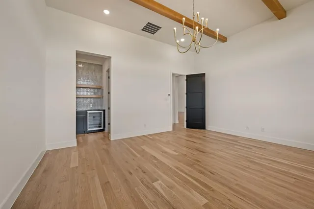 a kitchen with a sink and a refrigerator