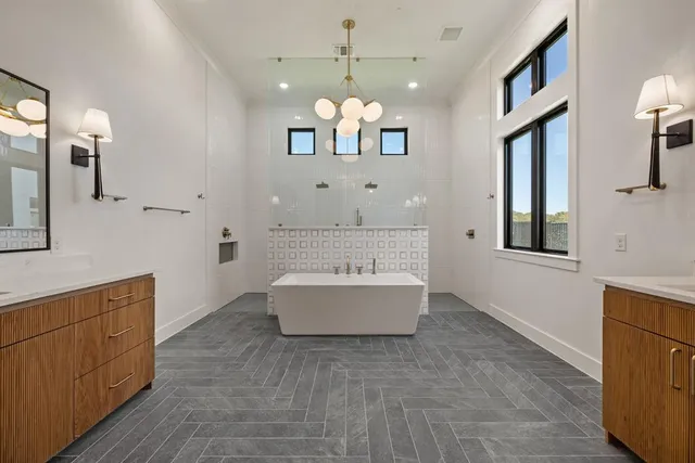 a view of a kitchen with a sink and chandelier