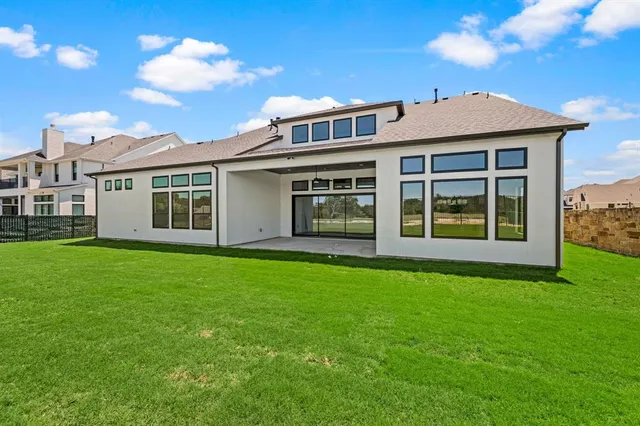 a view of a house with a big yard