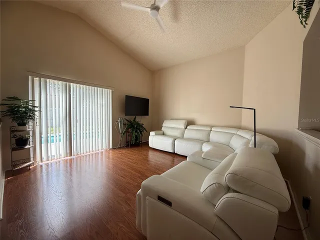 a bedroom with a bed and a night stand