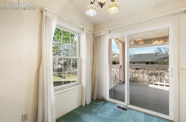 a view of an empty room with window