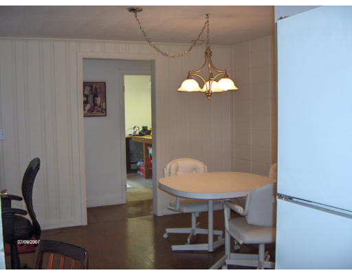 21 Irving Road Natick, MA 01760 - Photo 11 of 13 a view of a dining room with furniture and wooden floor