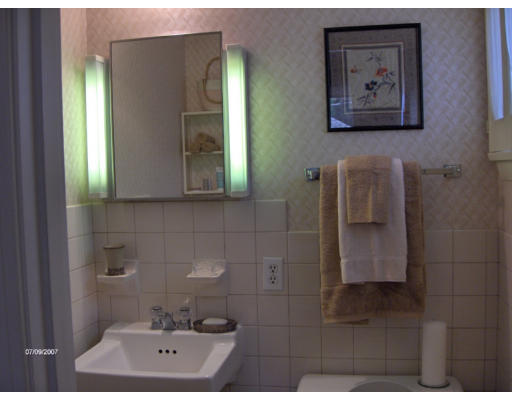 21 Irving Road Natick, MA 01760 - Photo 8 of 13 a bathroom with a bathtub and a sink