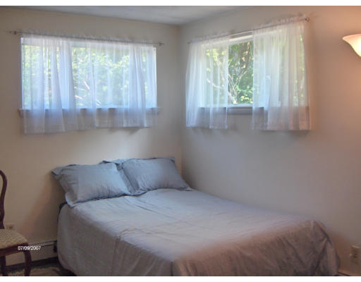 21 Irving Road Natick, MA 01760 - Photo 9 of 13 a bedroom with a bed and window