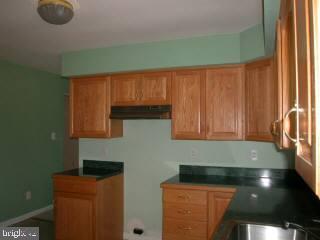20525 Nanticoke Road Nanticoke, MD 21840 - Photo 3 of 6 a kitchen with a sink and a microwave