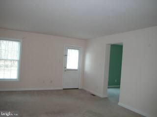 20525 Nanticoke Road Nanticoke, MD 21840 - Photo 4 of 6 an empty room with windows