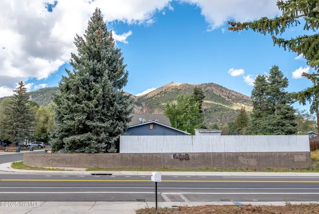 a view of street along with residential houses