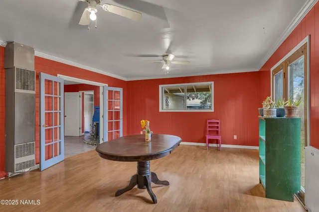 a workspace with furniture window and wooden floor