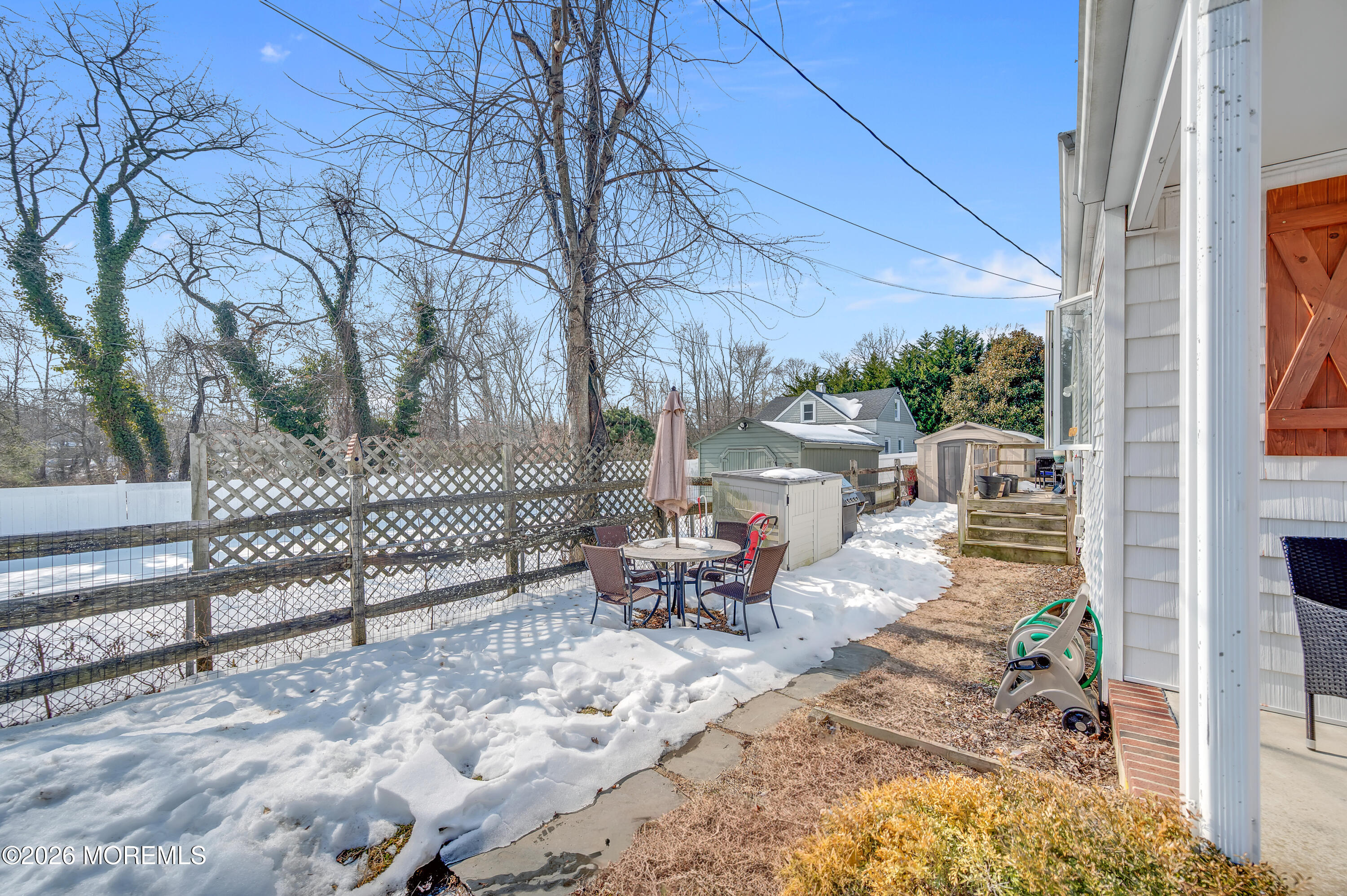 1429 Marconi Road Wall, NJ 07719 - Photo 18 of 21 a view of a patio with a table and chairs