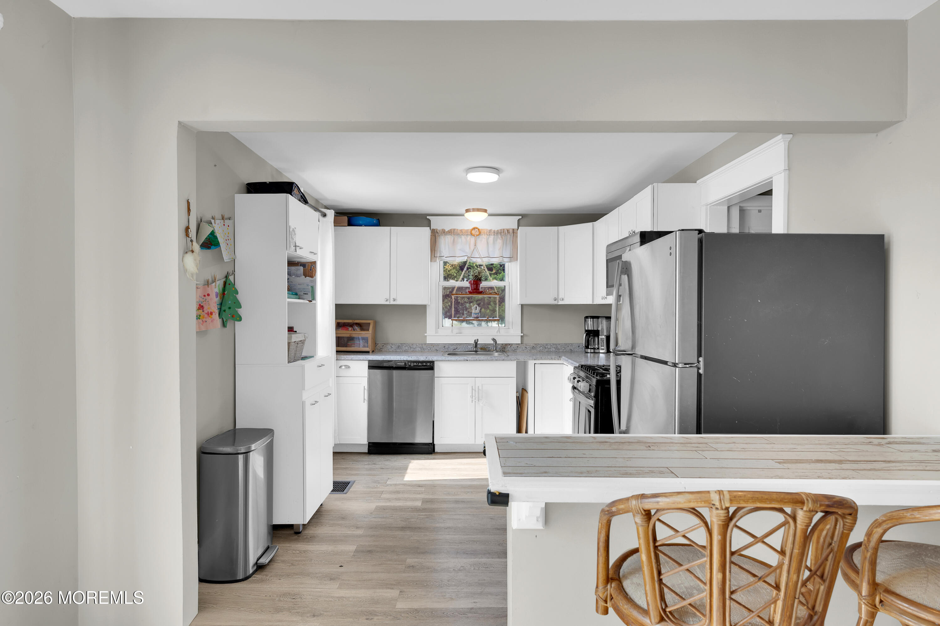 1429 Marconi Road Wall, NJ 07719 - Photo 3 of 21 a kitchen with white cabinets and stainless steel appliances
