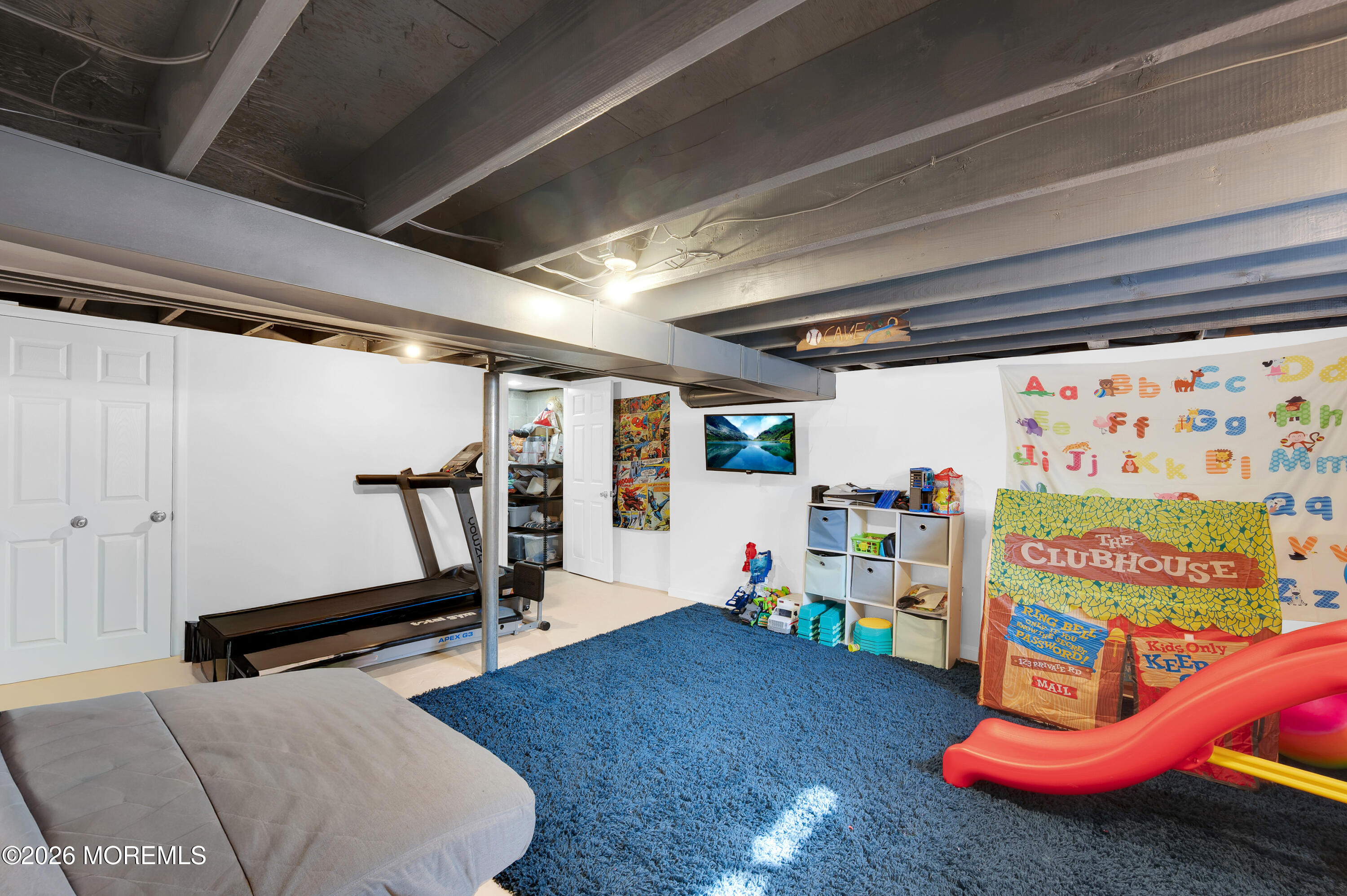 1429 Marconi Road Wall, NJ 07719 - Photo 7 of 21 a garage with a table and gym equipment