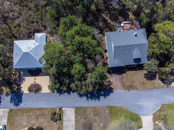 an aerial view of house with yard