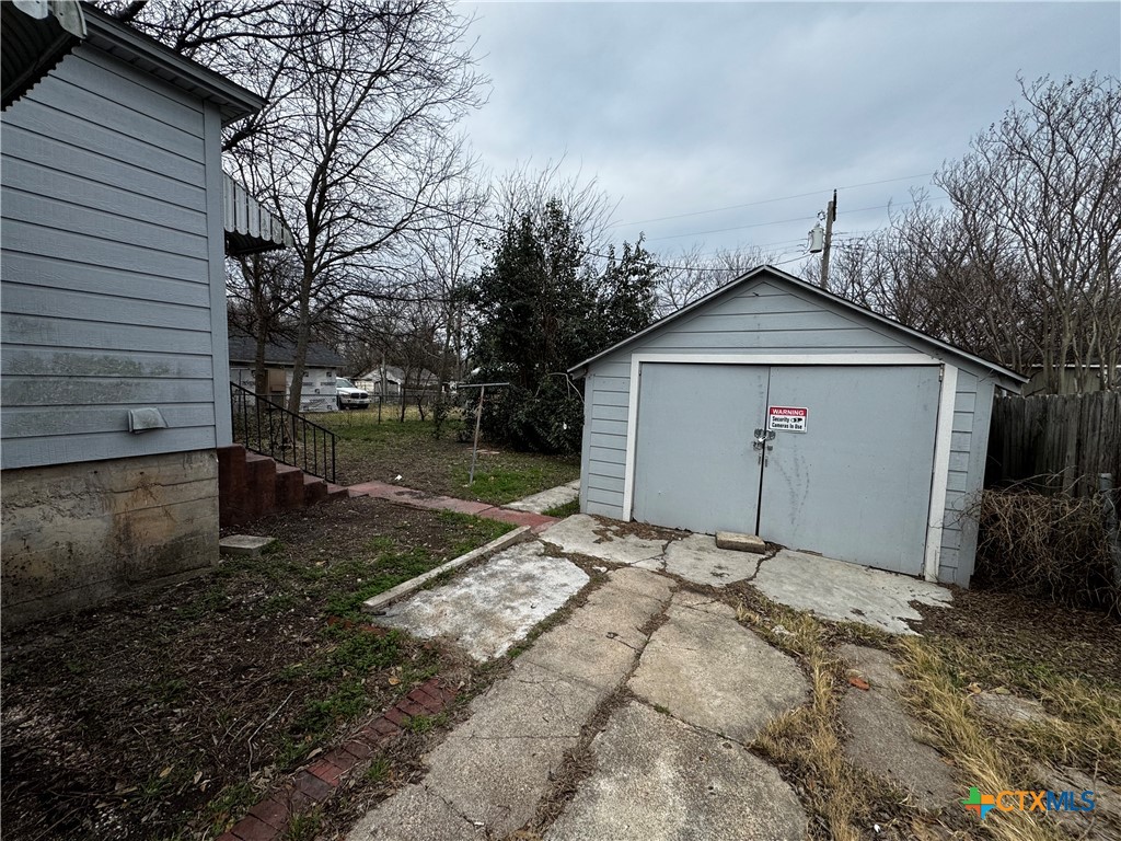1010 South 17th Street Temple, TX 76504 - Photo 24 of 30 a view of a house with a yard and garage