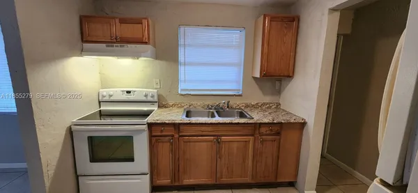 a kitchen with a stove and a microwave