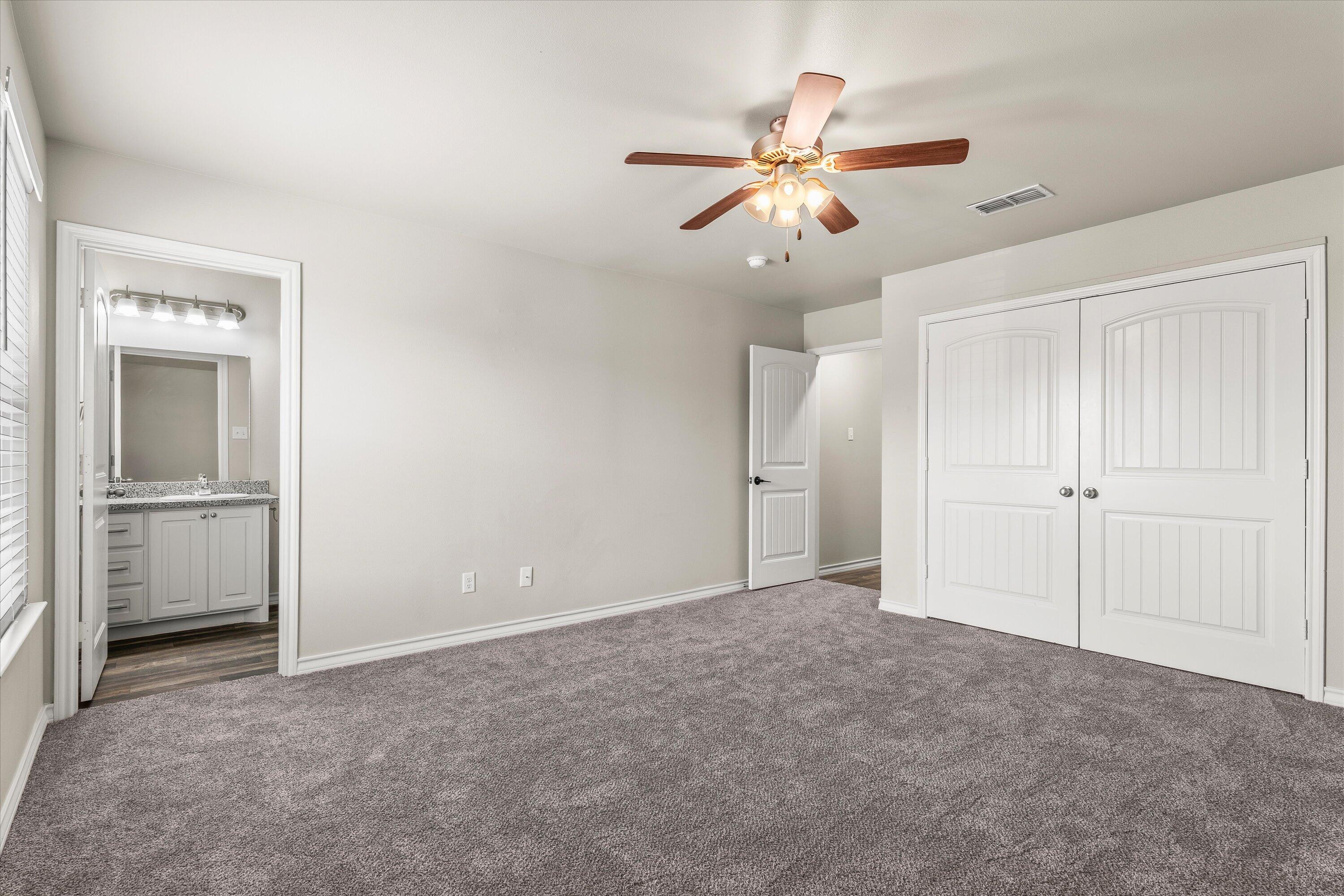 6040 24th Street, Unit 10 Lubbock, TX 79407 - Photo 18 of 29 a view of an empty room with a window