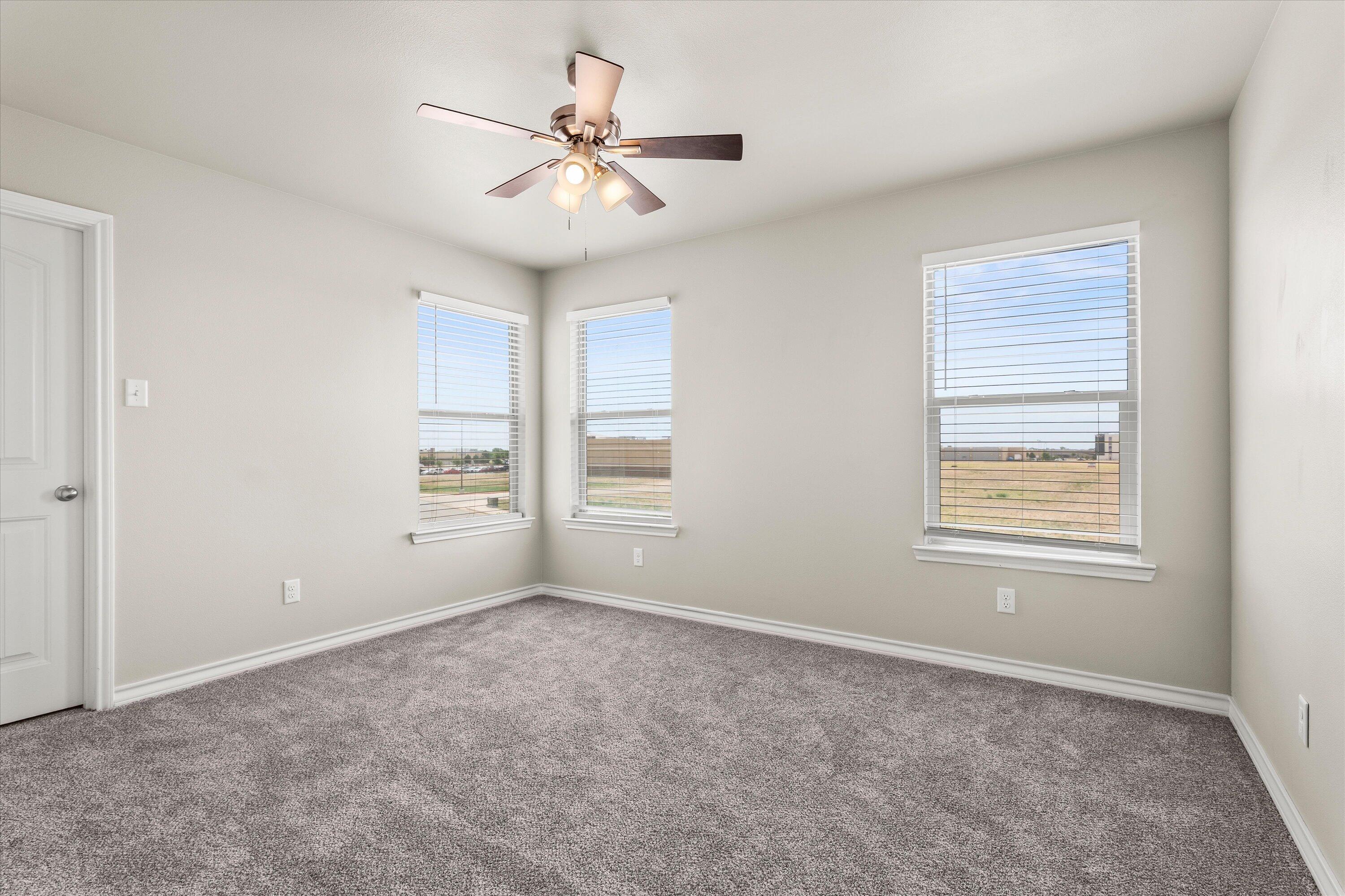 6040 24th Street, Unit 10 Lubbock, TX 79407 - Photo 20 of 29 a view of an empty room with a window