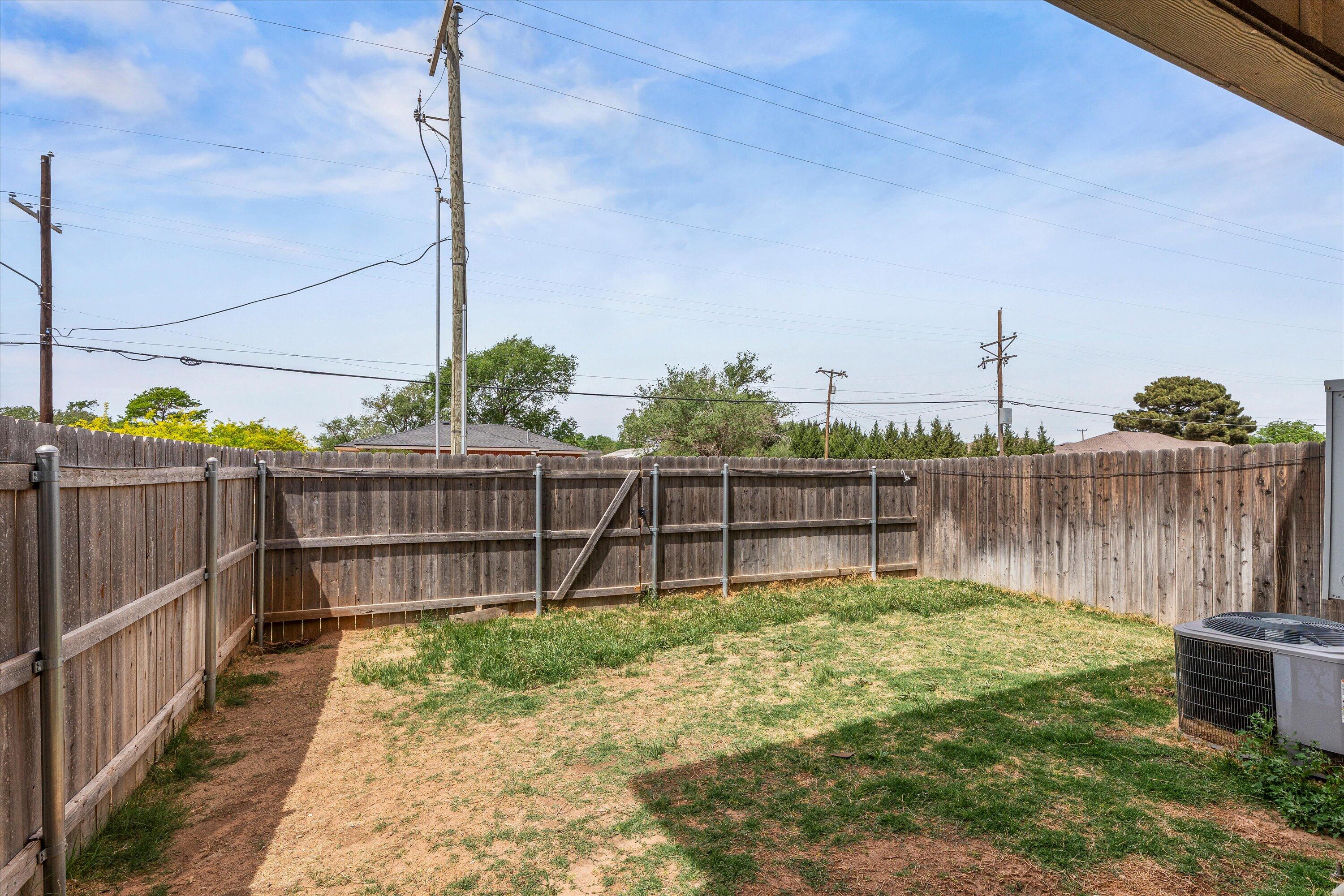 6040 24th Street, Unit 10 Lubbock, TX 79407 - Photo 28 of 29 a small garden view