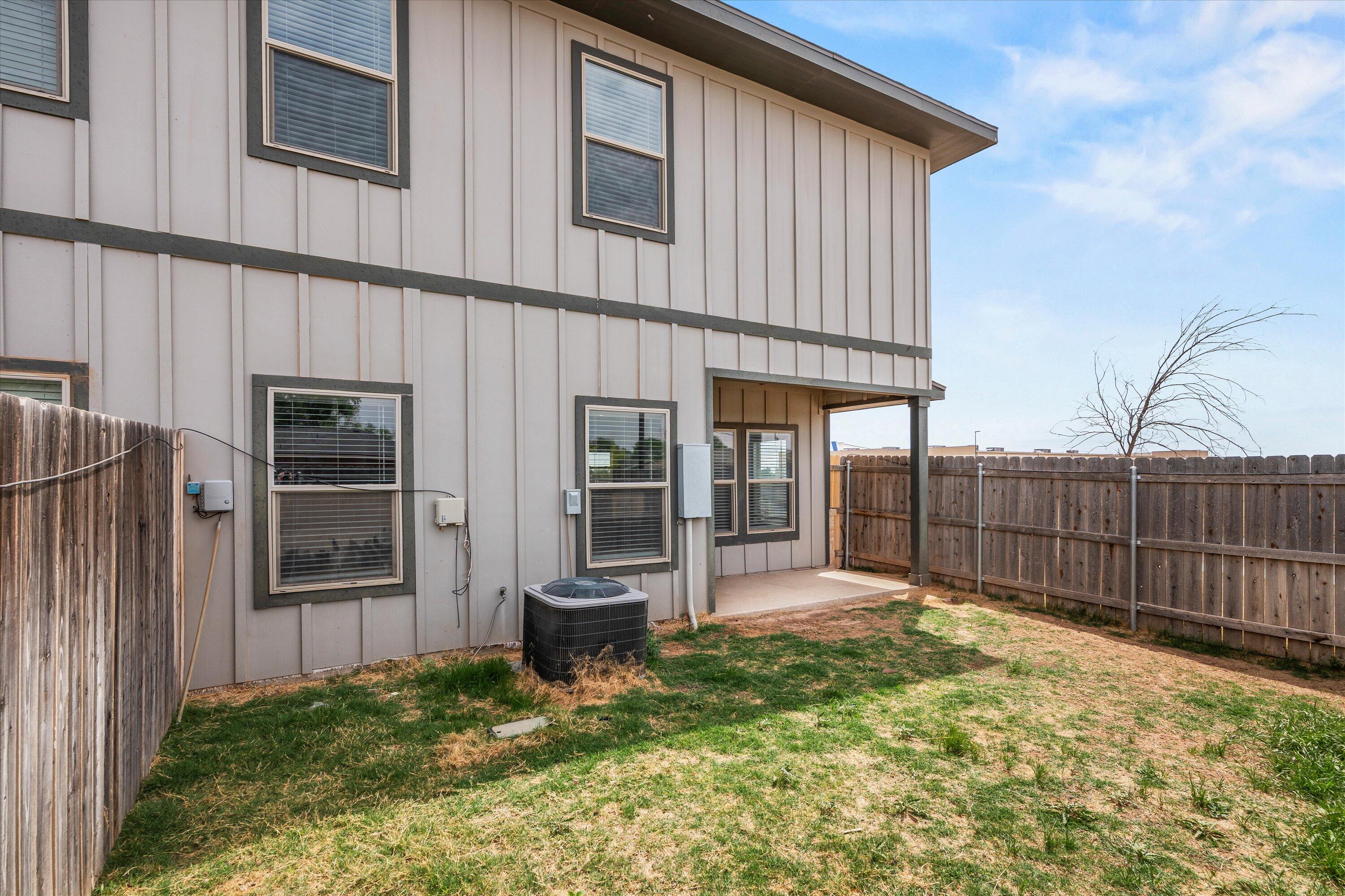 6040 24th Street, Unit 10 Lubbock, TX 79407 - Photo 29 of 29 a backyard of a house