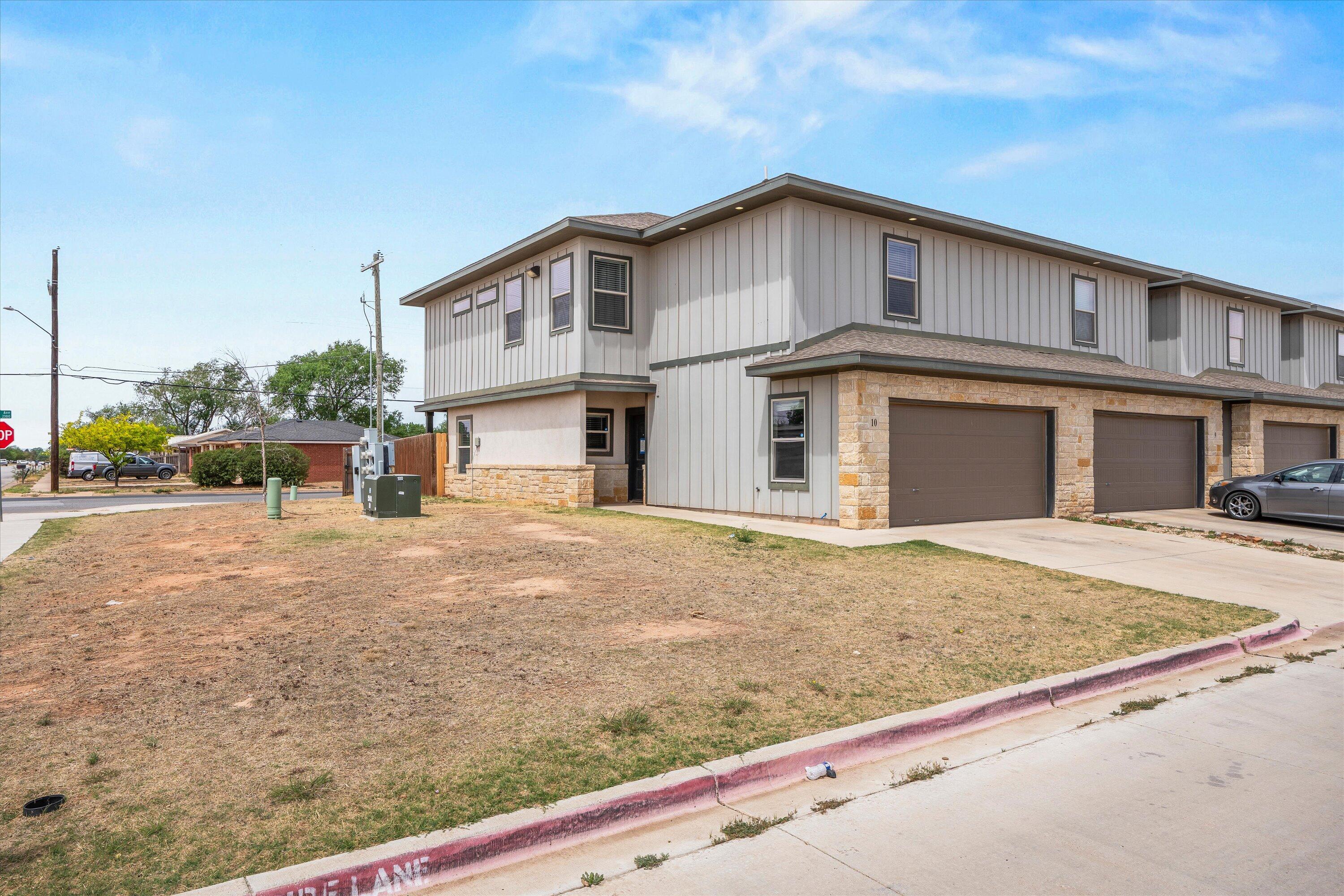 6040 24th Street, Unit 10 Lubbock, TX 79407 - Photo 3 of 29 a view of a house with a outdoor space