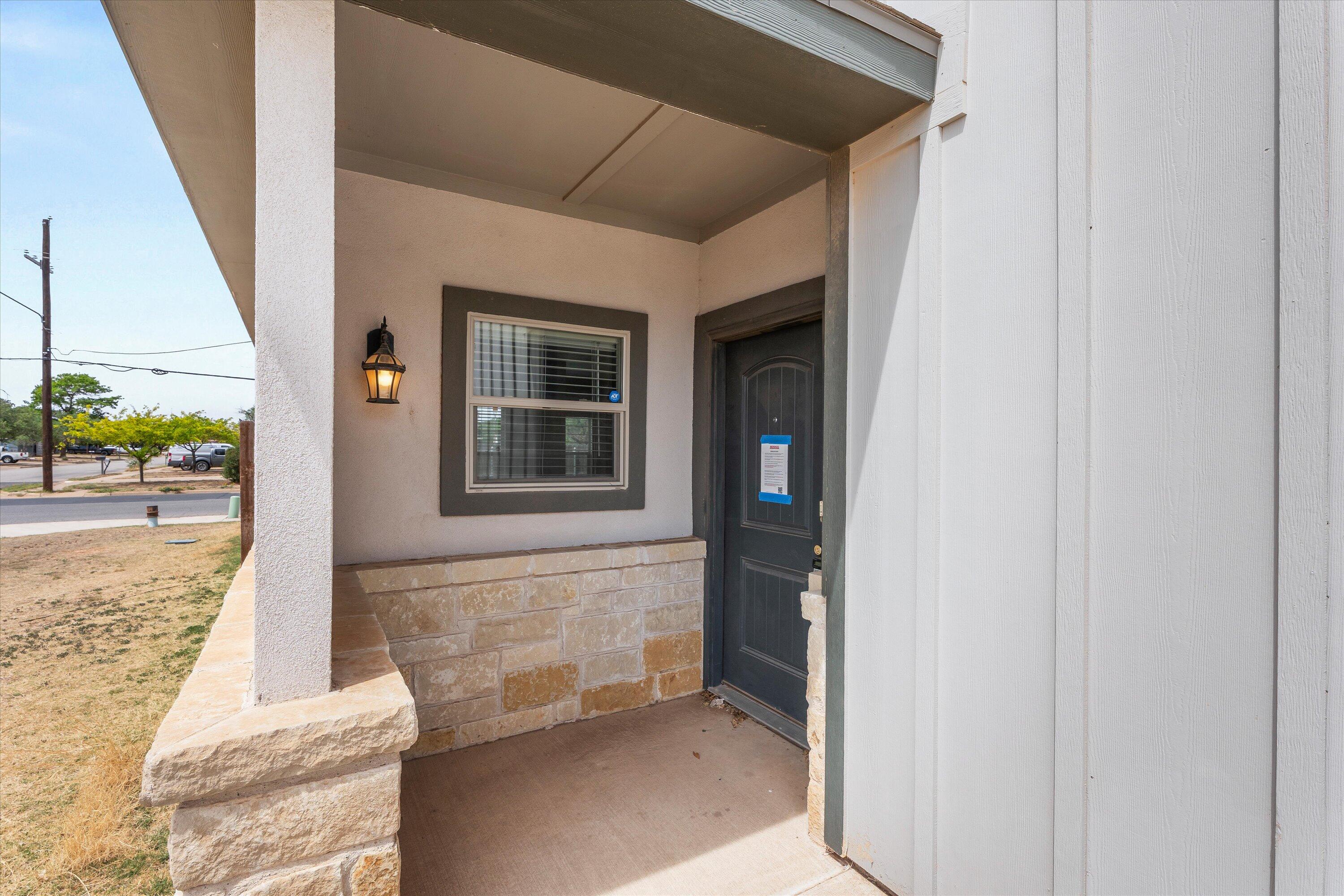 6040 24th Street, Unit 10 Lubbock, TX 79407 - Photo 5 of 29 a view of front door of house