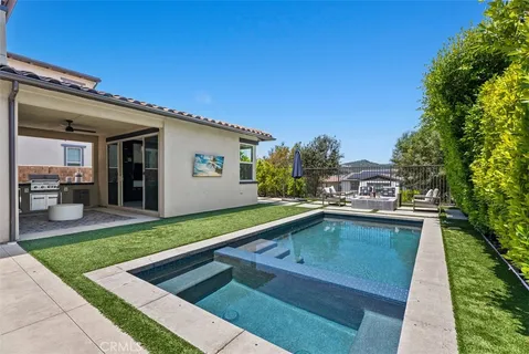 a view of a backyard with sitting area