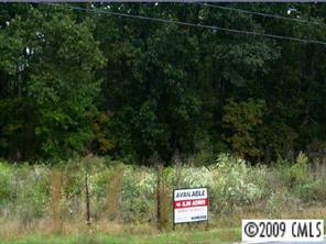 7851 Mt Olive Road Concord, NC 28025 - Photo 1 of 1 a sign that is sitting in front of a tree