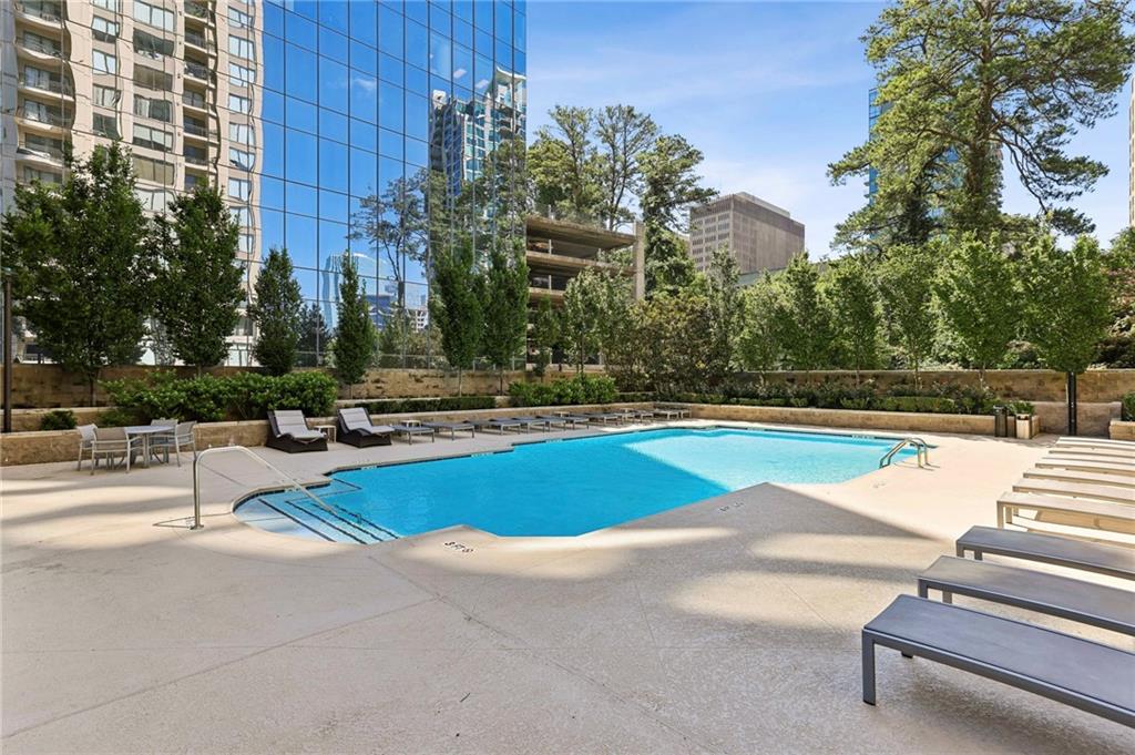 3445 Stratford Road Northeast, Unit 3105 Atlanta, GA 30326 - Photo 32 of 47 a view of swimming pool with chairs