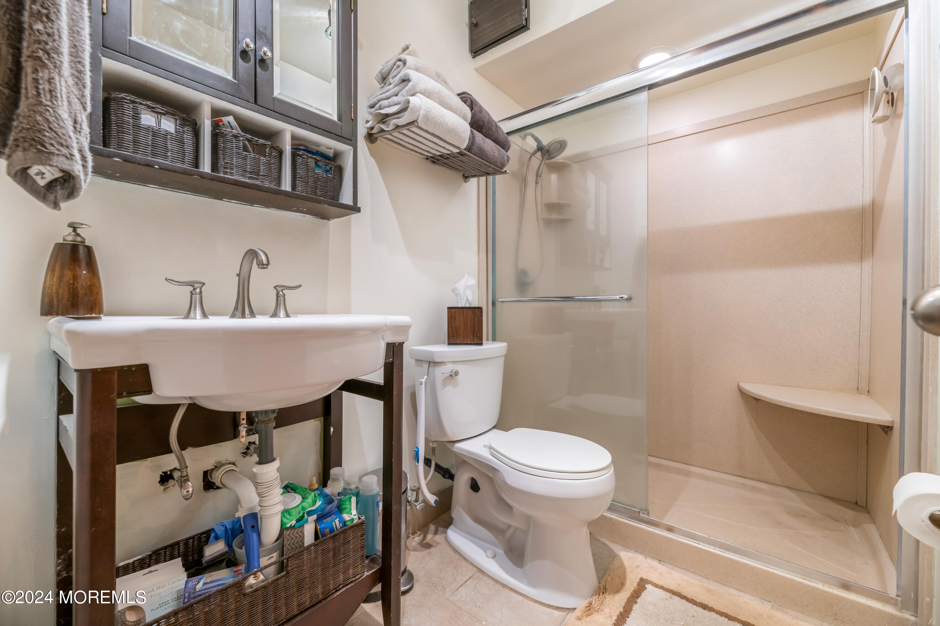 200 Portland Road, Unit D10 Highlands, NJ 07732 - Photo 16 of 16 a bathroom with a sink toilet and shower