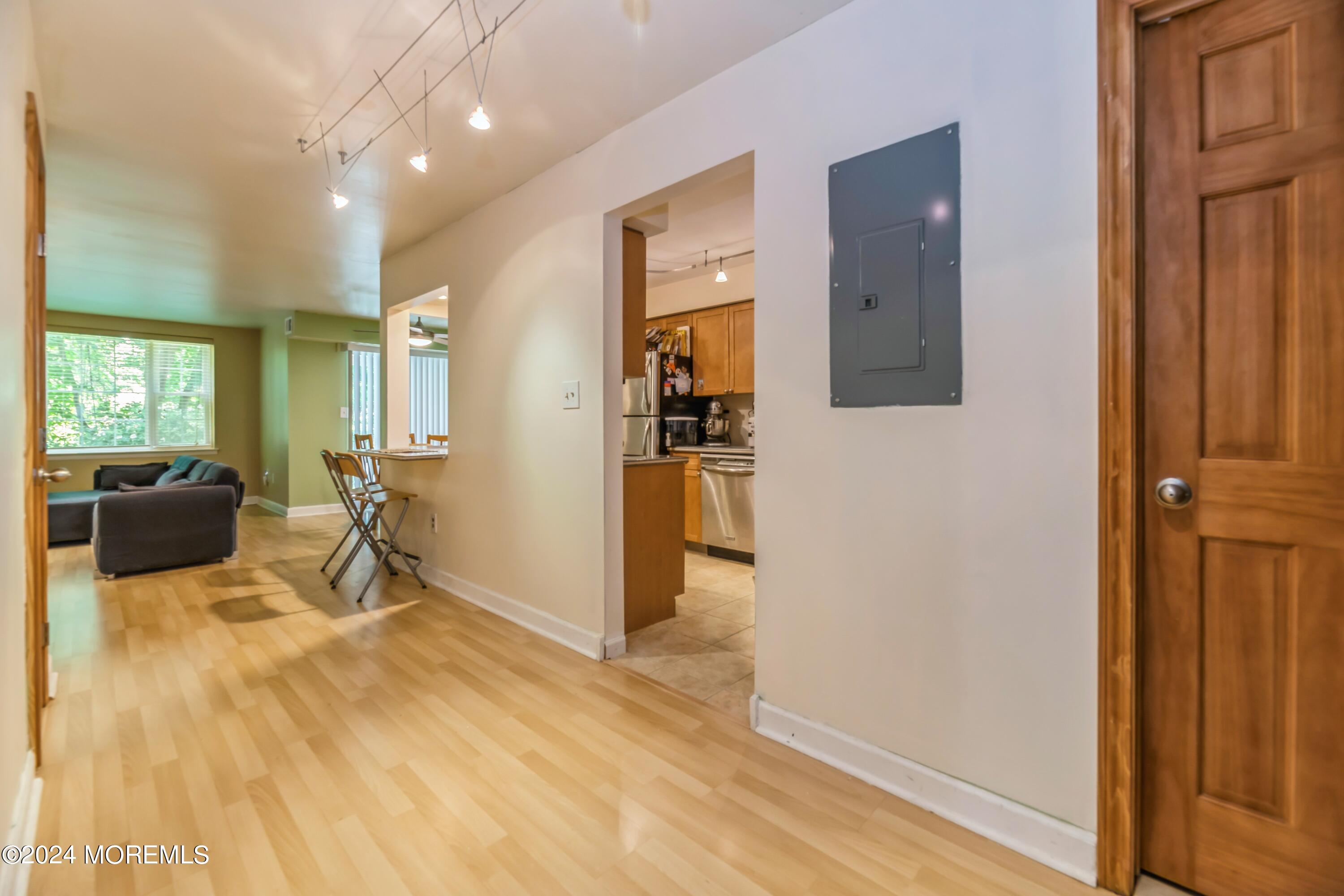 200 Portland Road, Unit D10 Highlands, NJ 07732 - Photo 5 of 16 a living room with furniture and a flat screen tv