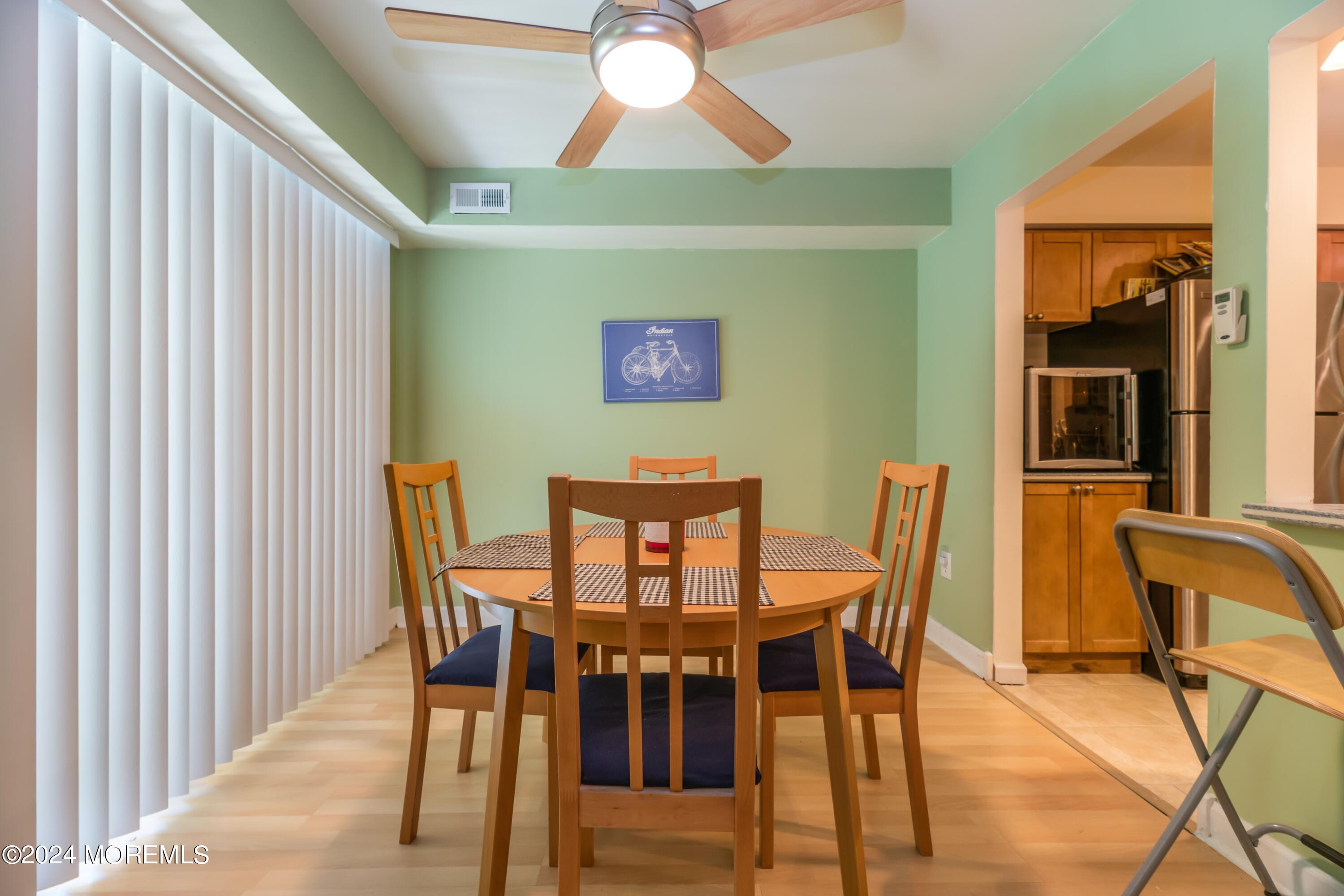 200 Portland Road, Unit D10 Highlands, NJ 07732 - Photo 6 of 16 a view of a dining room with furniture and chandelier