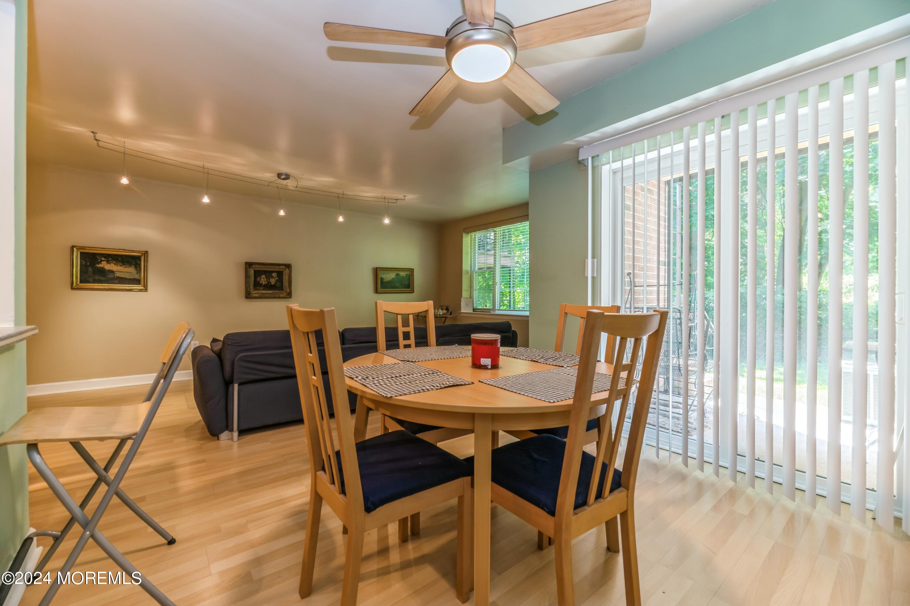 200 Portland Road, Unit D10 Highlands, NJ 07732 - Photo 7 of 16 a view of a dining room with furniture window and wooden floor