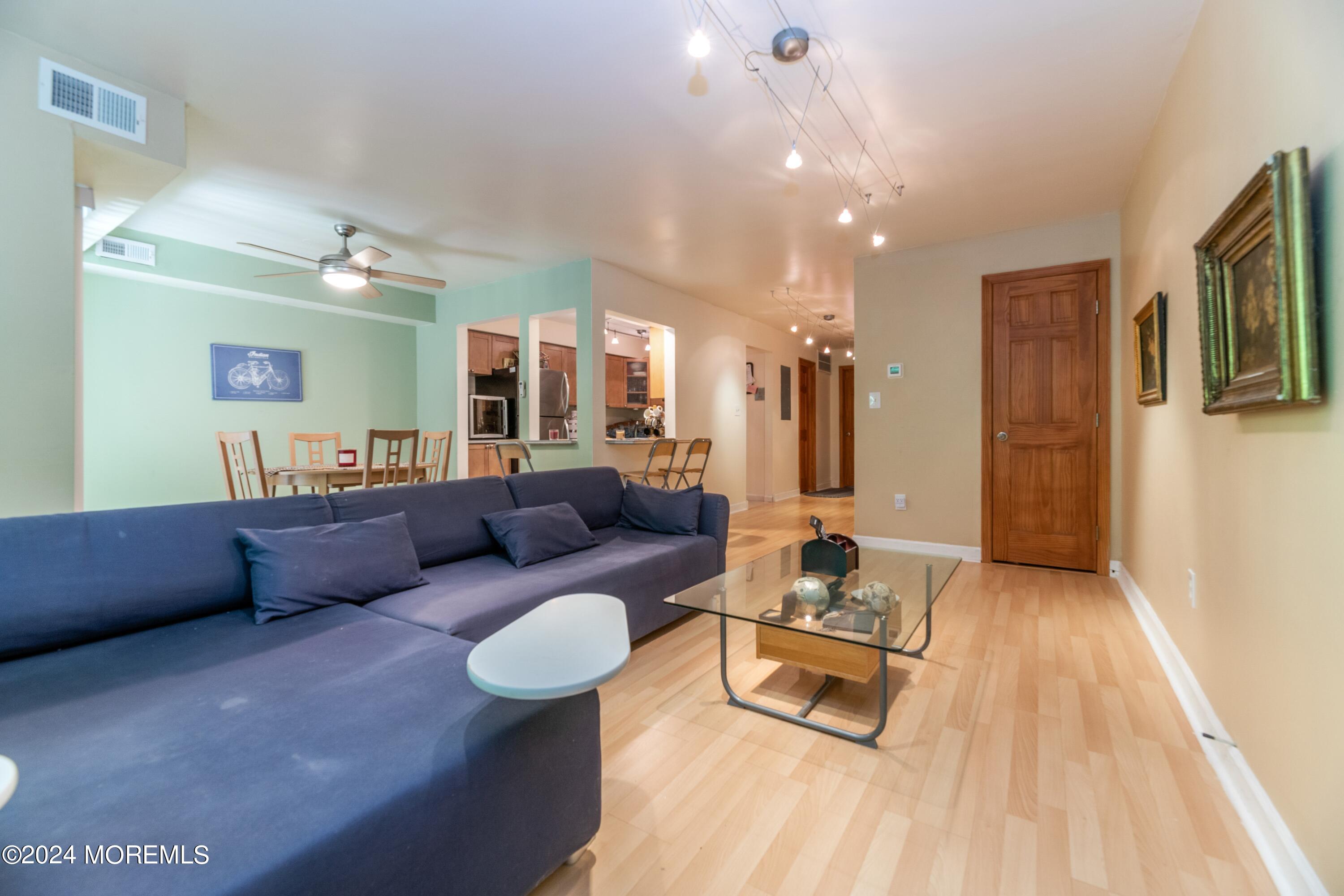 200 Portland Road, Unit D10 Highlands, NJ 07732 - Photo 10 of 16 a living room with furniture and a wooden floor
