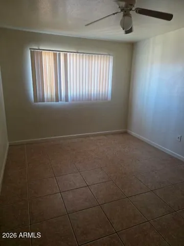 a view of a livingroom with a chandelier fan
