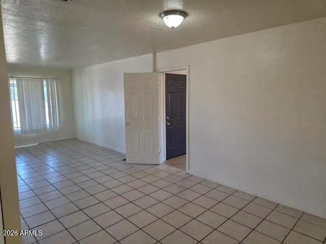 a view of an empty room with a flat screen tv