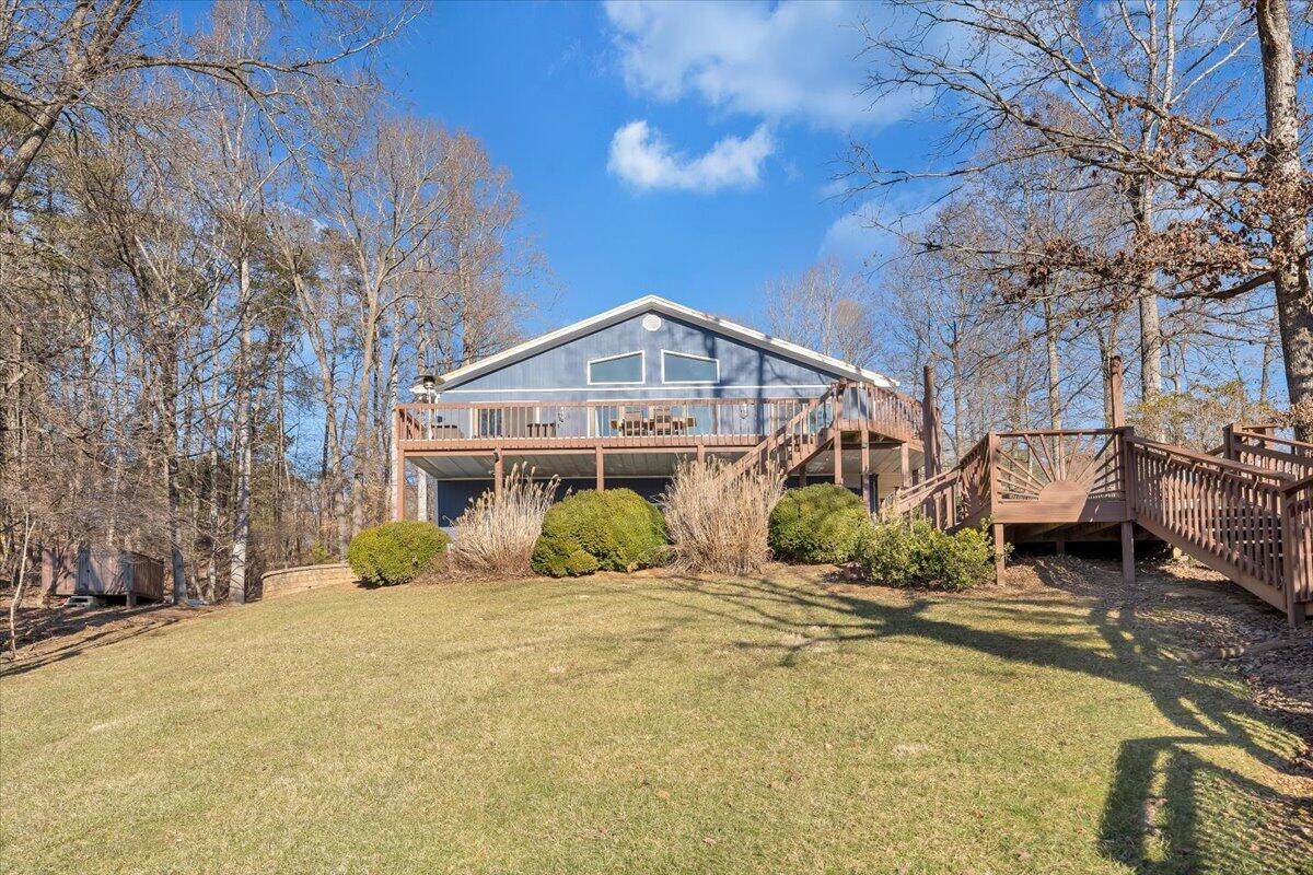 140 Sandy Point Court Union Hall, VA 24176 - Photo 48 of 86 a front view of a house with a yard outdoor seating and covered with trees