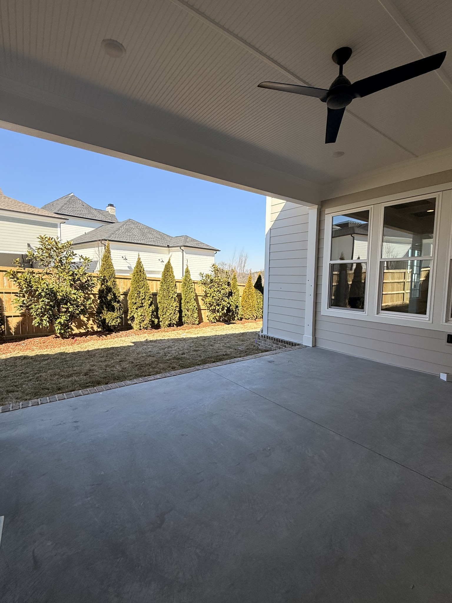 1000 Legrand Avenue Franklin, TN 37064 - Photo 6 of 17 a view of an empty room with a fireplace and chandelier