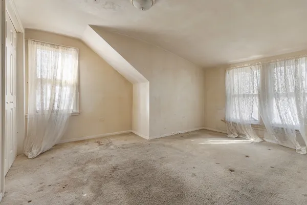 an empty room with windows