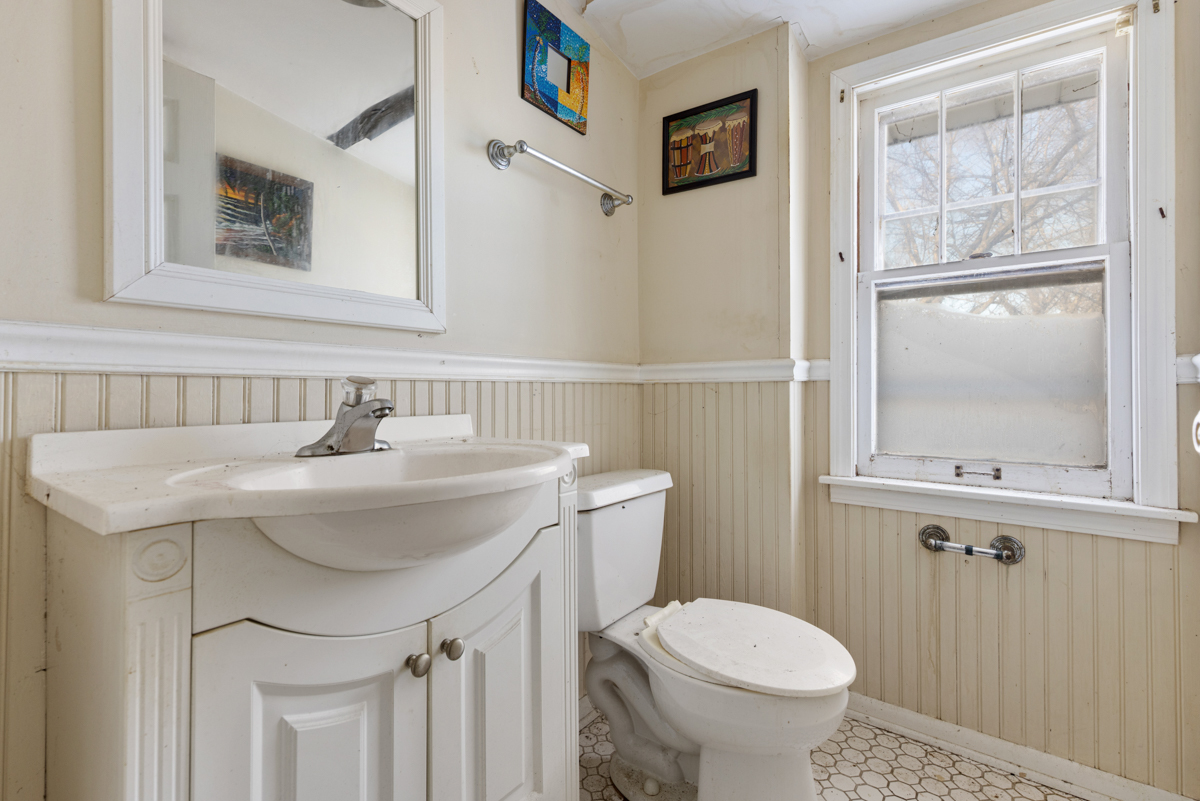 3310 186th Street Lansing, IL 60438 - Photo 15 of 19 a bathroom with a sink and a toilet