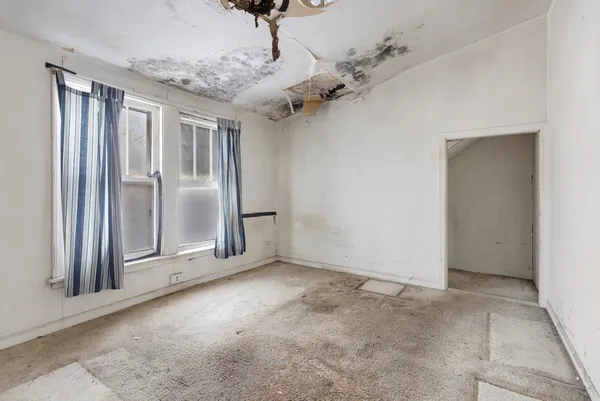 an empty room with windows