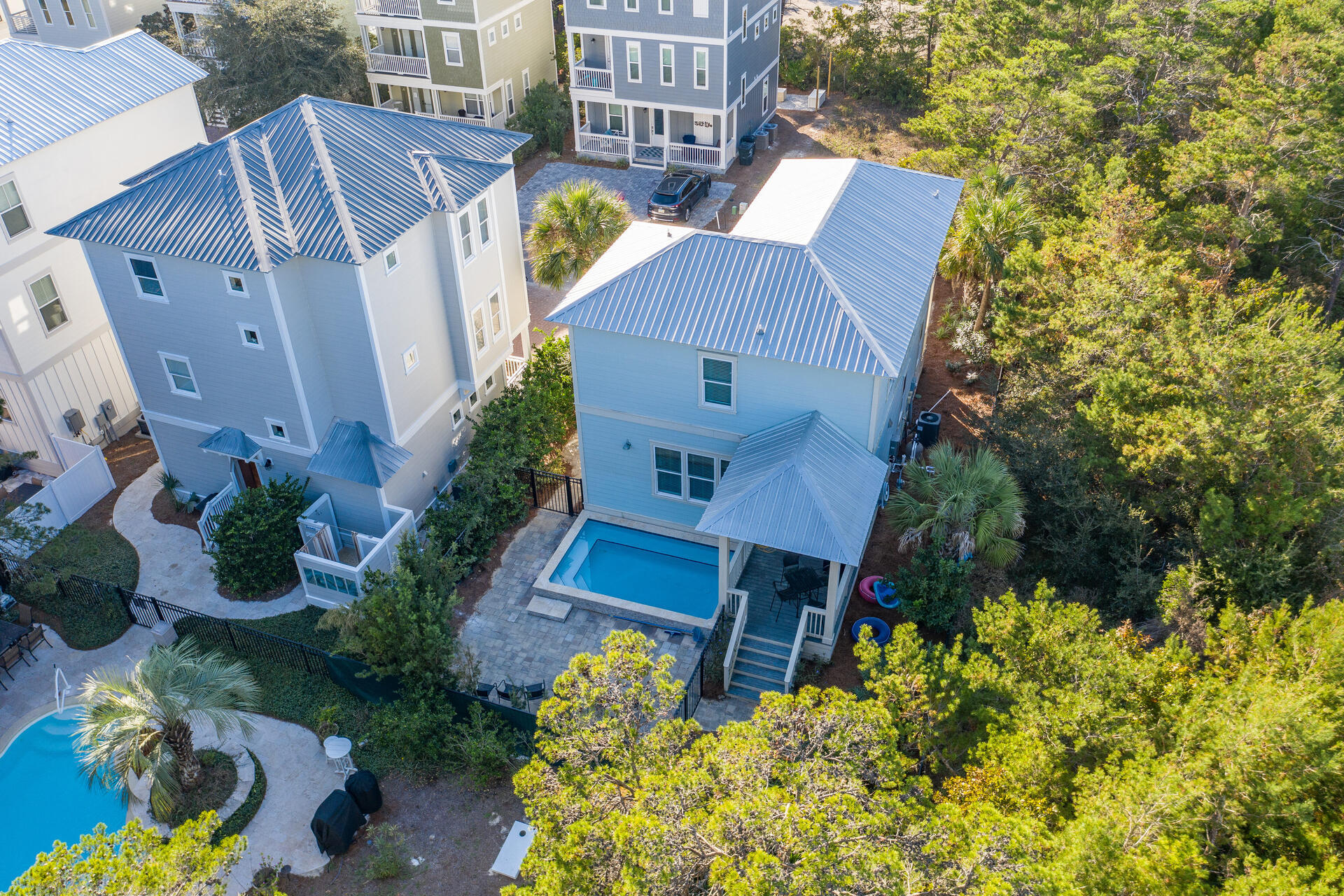 a view of a house with a patio and garden