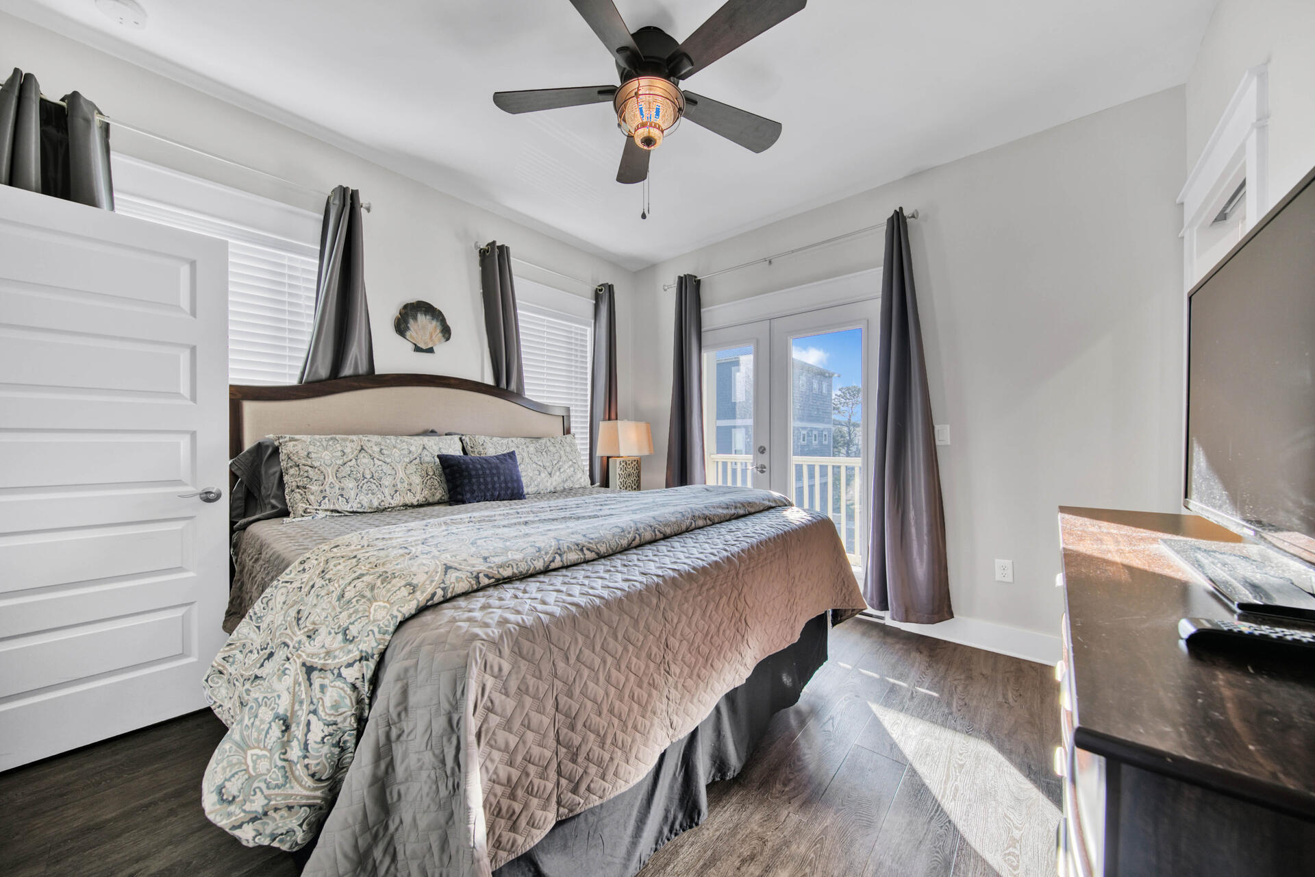 56 Abbey Road Santa Rosa Beach, FL 32459 - Photo 14 of 40 a bedroom with a bed and a flat tv screen on dresser