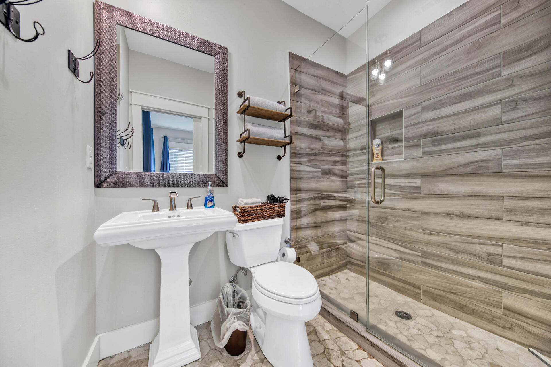 56 Abbey Road Santa Rosa Beach, FL 32459 - Photo 17 of 40 a bathroom with a sink a toilet and shower