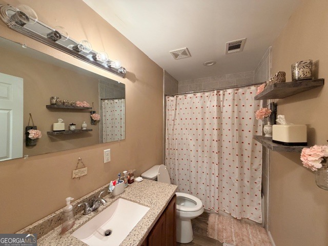 226 Lake Laurel Road Milledgeville, GA 31061 - Photo 23 of 25 a bathroom with a sink toilet and shower