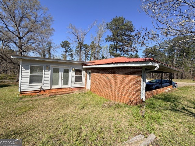 226 Lake Laurel Road Milledgeville, GA 31061 - Photo 3 of 25 front view of house with a garden
