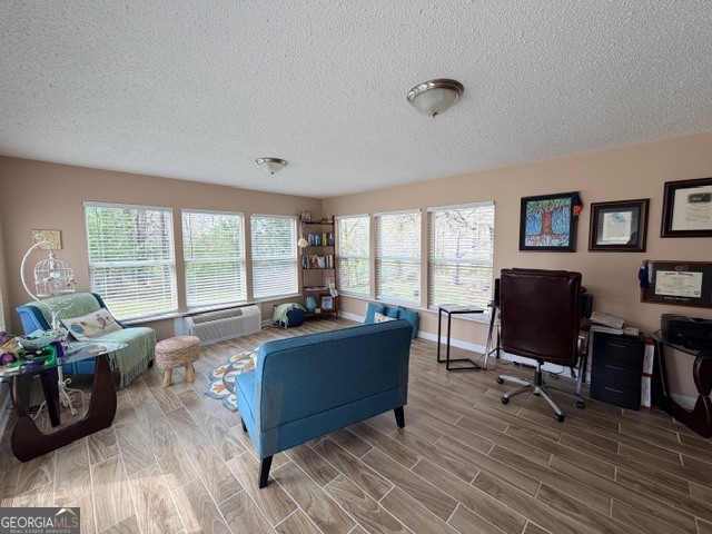 226 Lake Laurel Road Milledgeville, GA 31061 - Photo 9 of 25 a living room with furniture a flat screen tv and a large window